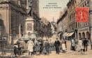 Carte postale ancienne - Besançon - Statue Jouffroy et Rue de la Madeleine