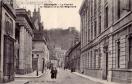 Carte postale ancienne - BESANÇON - La Faculté le Théâtre et la rue Mégevand